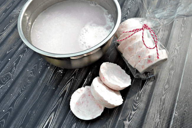 Learn how to make homemade bath fizzies, also called homemade bath bombs. Packaged up with a bag and ribbon or in a jar make a cute handmade gift.