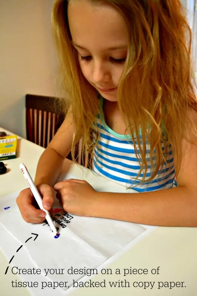 coloring on the tissue paper for diying your own printed candle.