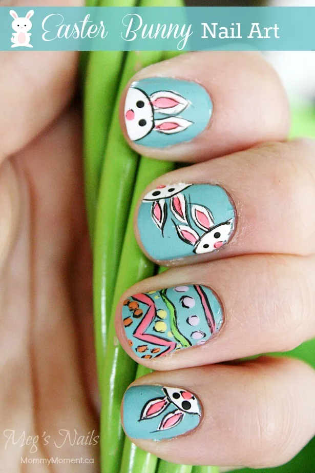 Easter bunny nails with a teal background.