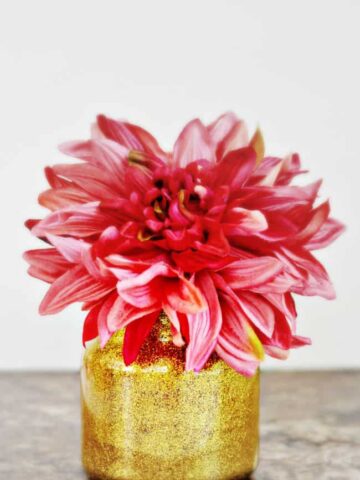 Jazz up your home with this diy glitter vase, perfect for recycling old candle jars.