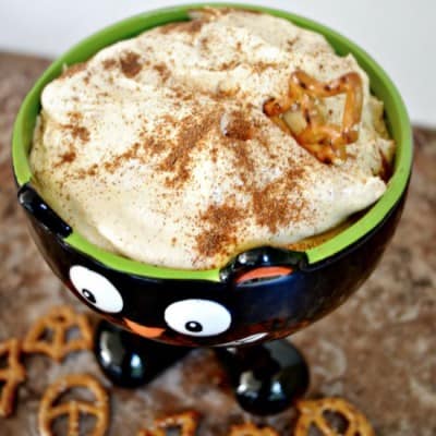 This creamy pumpkin cheesecake dip is perfect for your next fall party. It whips up in less than 10 minutes and you are good to go. Great with salty pretzels, apples and more.