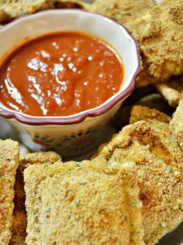 These baked ravioli appetizers are perfect for your holiday or game day parties. Very similar to Olive Garden's toasted ravioli's. So yummy and broiled for a crispy goodness.