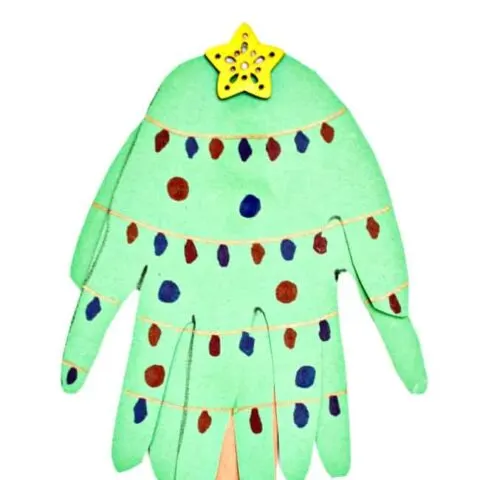 Create this fun Handprint Christmas Tree to remember how big your kiddos hands were this year. Super simple with just two supplies needed. Which you probably already have on hand.