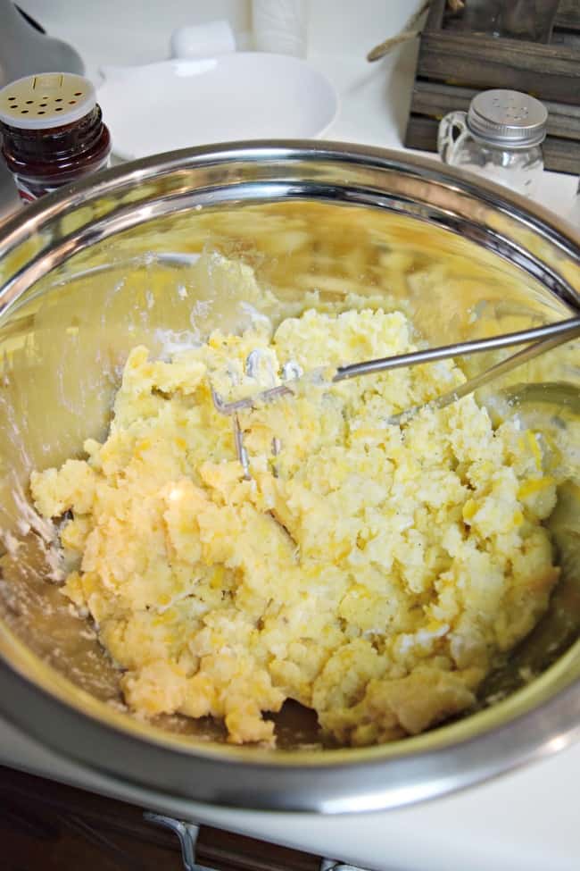 How can you go wrong with an easy twice baked potato recipe with cheese, bacon, green onions and butter? Super simple to make and half the time as the normal method.