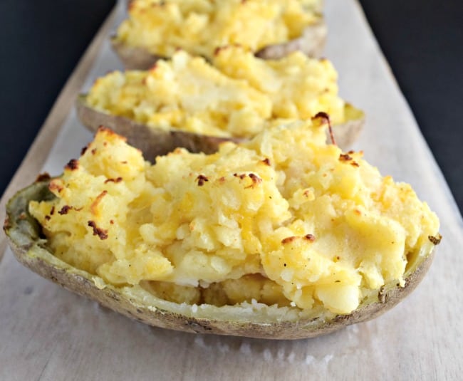 How can you go wrong with an easy twice baked potato recipe with cheese, bacon, green onions and butter? Super simple to make and half the time as the normal method.