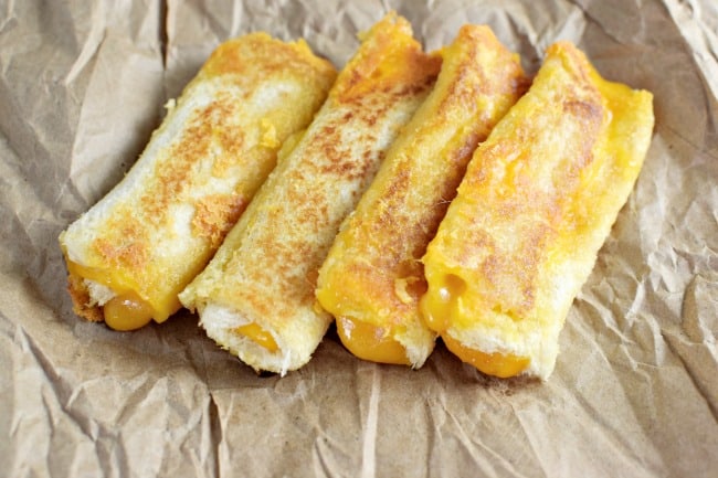 Give these fancy grilled cheese roll ups a try for your next party appetizer or for your kids' after-school snack. Just like a grilled cheese, but better!