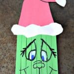 Create this super cute Popsicle Stick Grinch with your kids this holiday season. A perfect pairing with the classic book and movie.