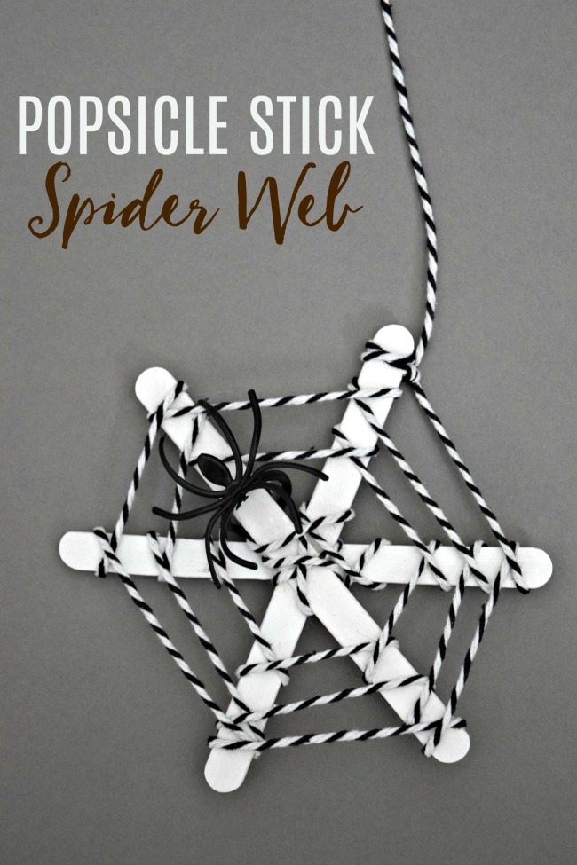 Spider web made with popsicle sticks and yarn