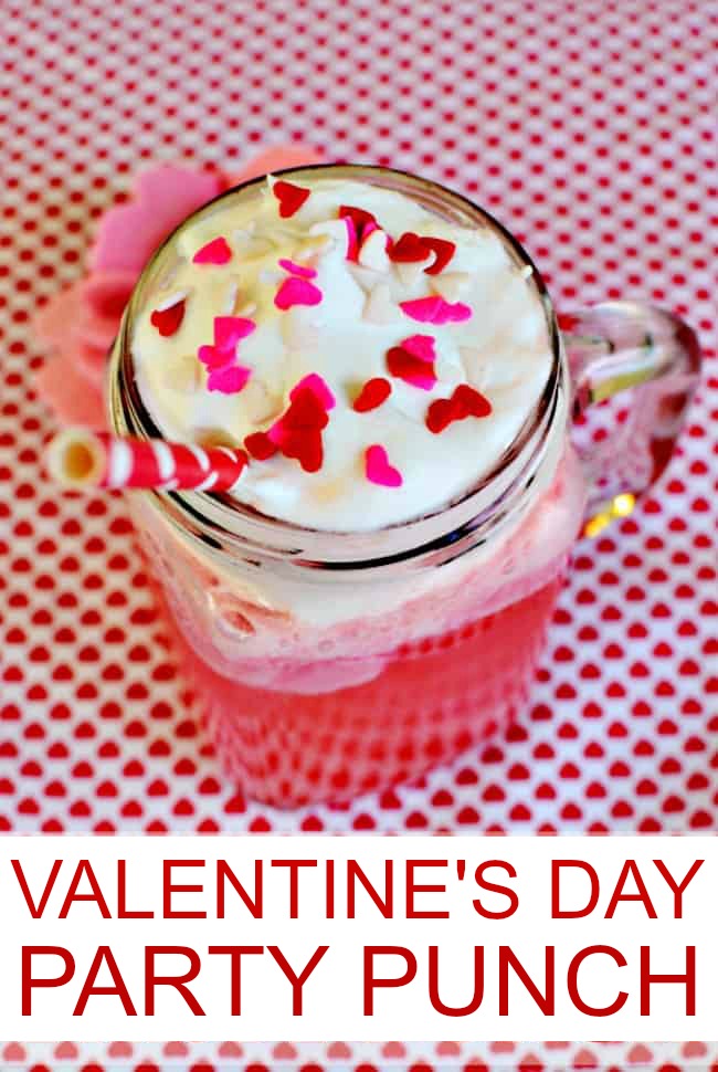 Pink Valentine's Day Punch in a mason jar with red and pink heart sprinkles