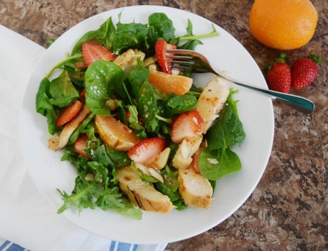 This Strawberry Orange Grilled Chicken Salad is so simple and delicious. A livened up version of a regular ole salad with bright and colorful fruit for a spicy and sweet taste.