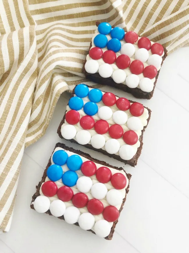 Patriotic Flag Brownies on a striped tea towel and white background.