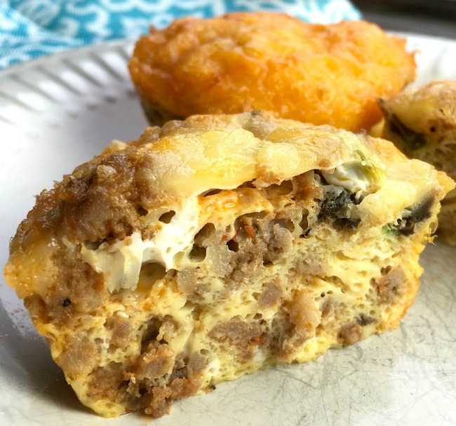 Photo of spicy egg muffins styled on a plate with a cut out of one showing what the inside looks like.Looking for the perfect make-ahead meal for those busy mornings we all seem to have? Well these low-carb, yet super tasty spicy breakfast muffins will do the trick. 