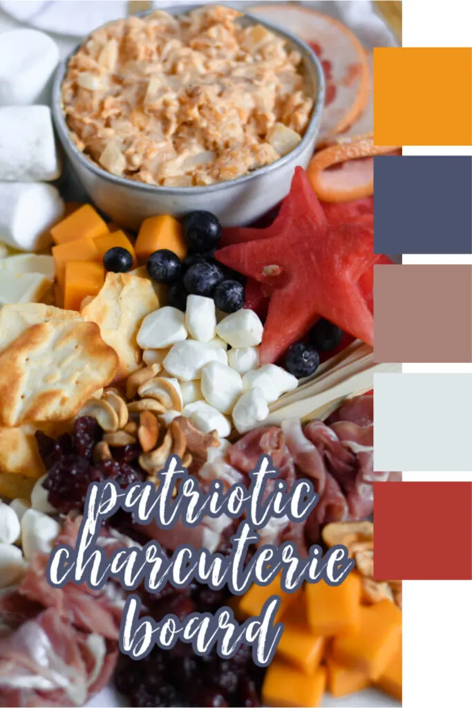 This photo features a marble slab with various red, white, and blue foods to create a beautiful patriotic charcuterie board for the 4th of July.