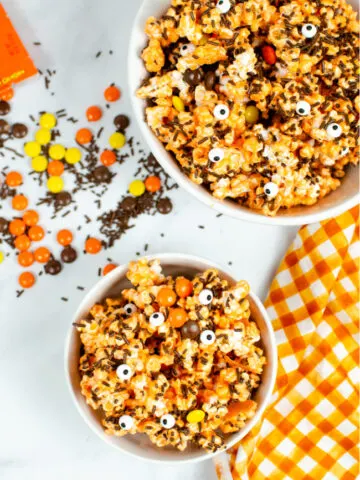 This image features a bowl of Monster Munch which is just popcorn mixed with Halloween themed candy.