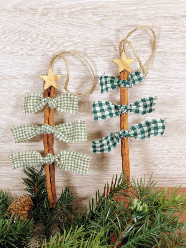 This photo features scrap fabric christmas tree ornaments perfect for holiday crafting also using cinnamon sticks and wooden stars.