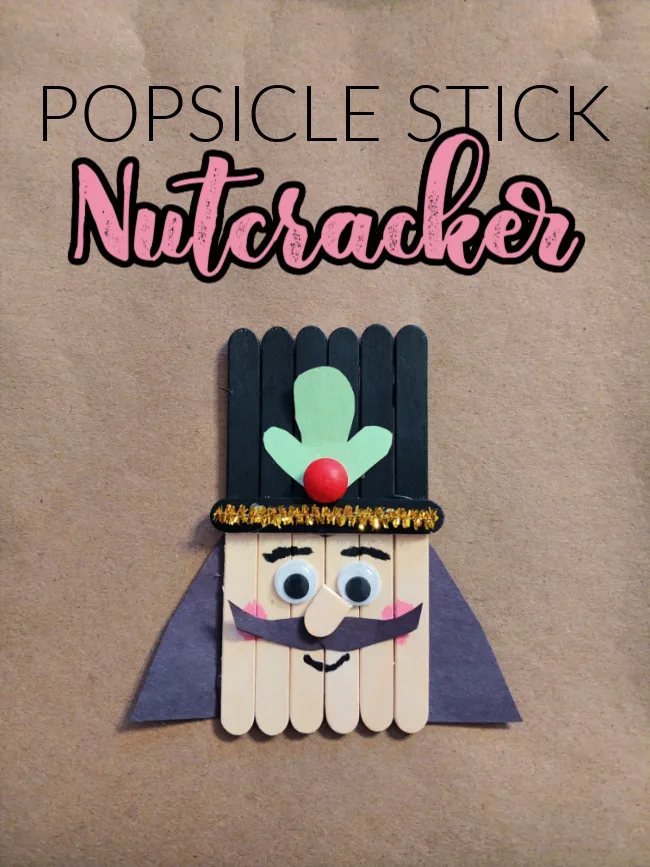 This photo features a popsicle stick nutcracker made out of craft sticks and made for kids to make during Christmastime.