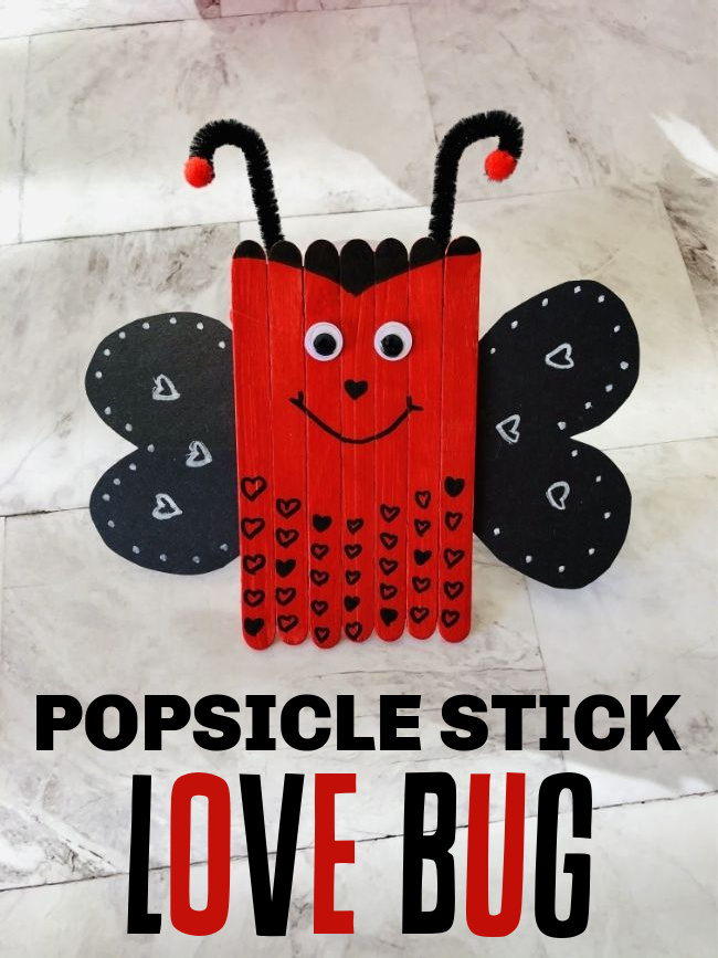 This photo features a created popsicle stick love bug valentine craft.