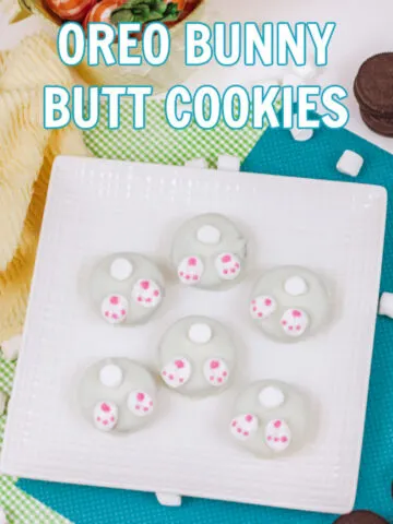 Oreo Bunny Butt Cookies on a white platter and a green and blue background