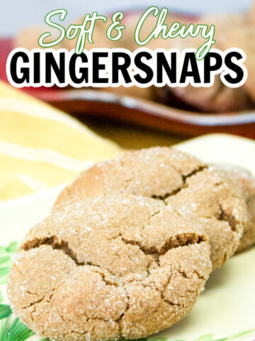Chewy Gingersnap Cookies lightly dusted with sugar and layed out on a Christmas tray