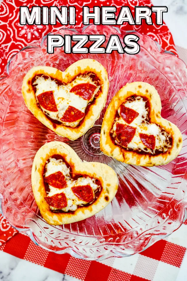 Mini Heart Pizzas on a red background