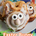 Propped up Easter Bunny Cinnamon Rolls on a white plate