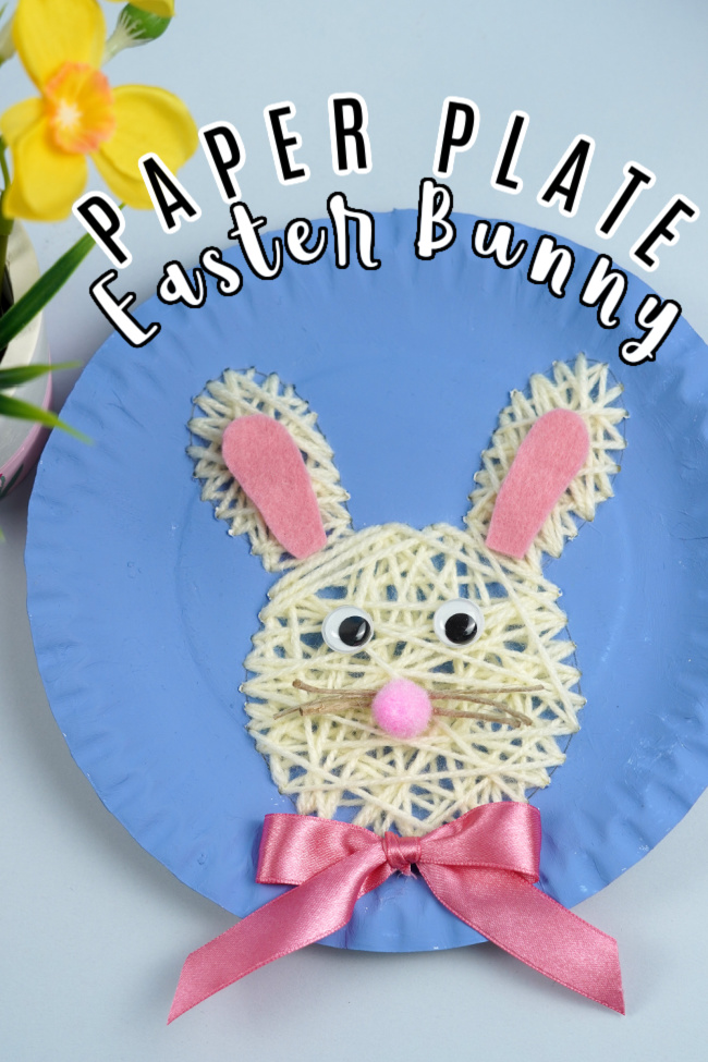 Paper plate Easter bunny made out of yarn on a white background
