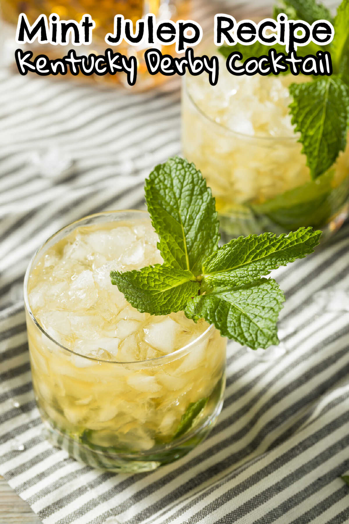 2 glasses of mint julep recipe on a white and gray striped tea towel