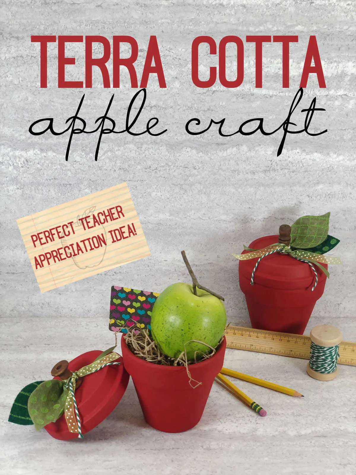 Completed Terra Cotta Pot Apple Craft filled with an actual green apple and gift card.