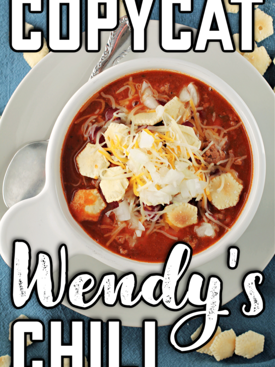 Copycat Wendy's Chili Recipe in a white bowl on a blue background