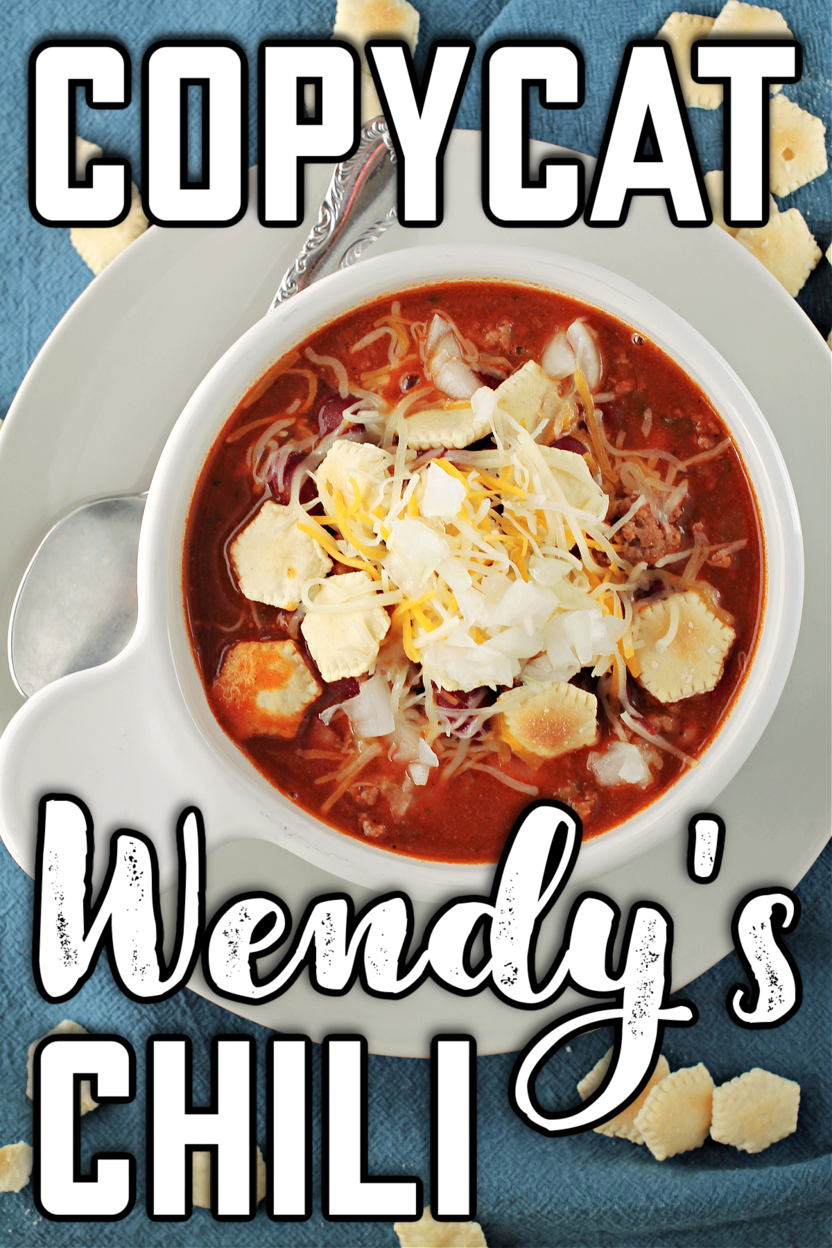 Copycat Wendy's Chili Recipe in a white bowl on a blue background