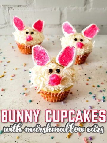 Easter Bunny Cupcakes with Marshmallow Ears on a marbled background with multicolored sprinkles.