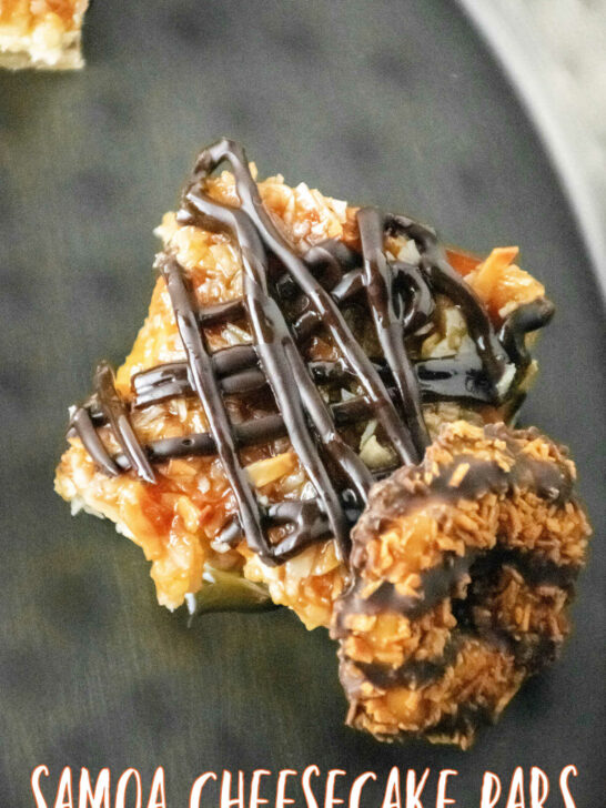Samoa Cheesecake Bars cut and placed beside a girl scout Samoa Cookie