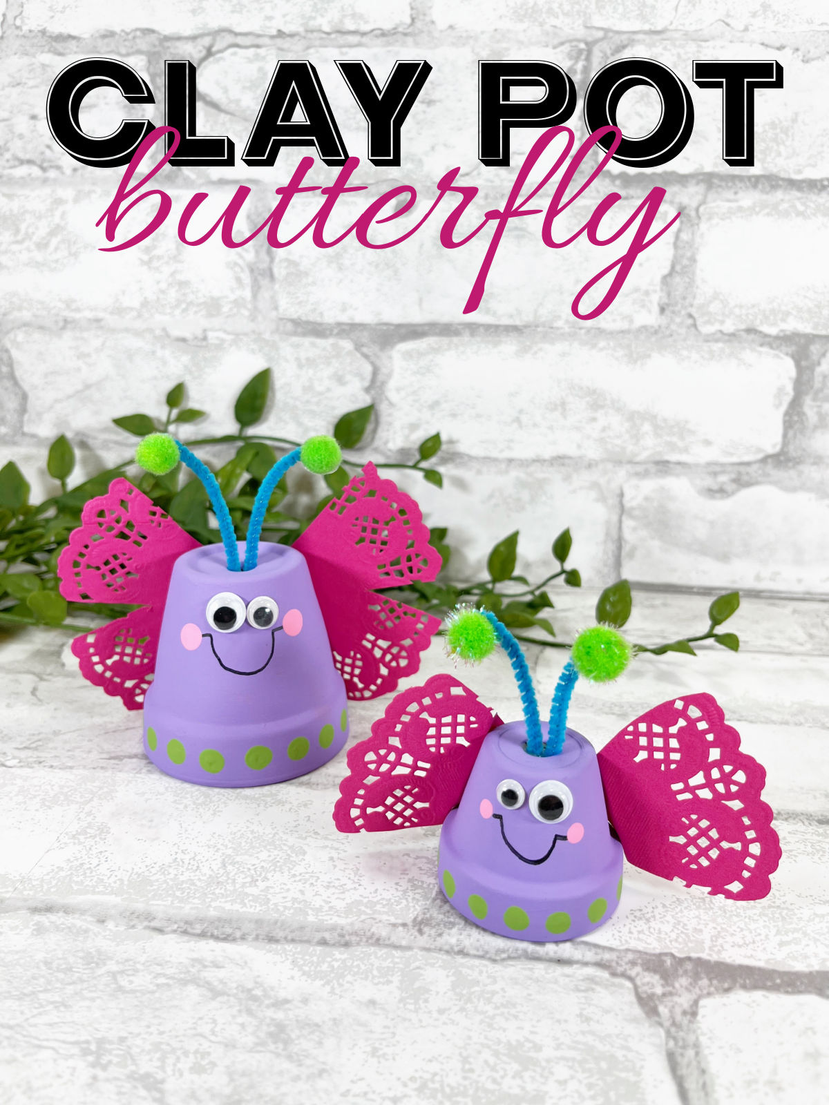 Clay Pot Butterfly Craft on a brick background