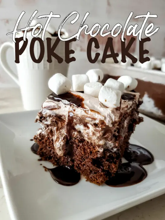 A slice of hot chocolate poke cake on a white dish