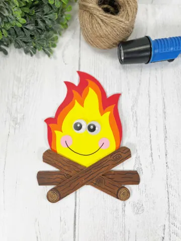 Popsicle Stick Campfire Craft on a white wooden background