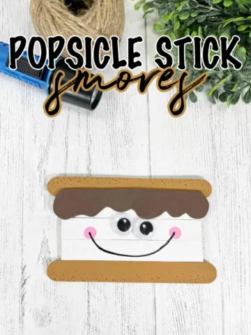 Popsicle Stick Smores Craft on a white shiplap background