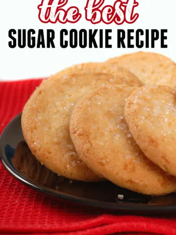 A black plate of sugar cookies with the title the best sugar cookie recipe
